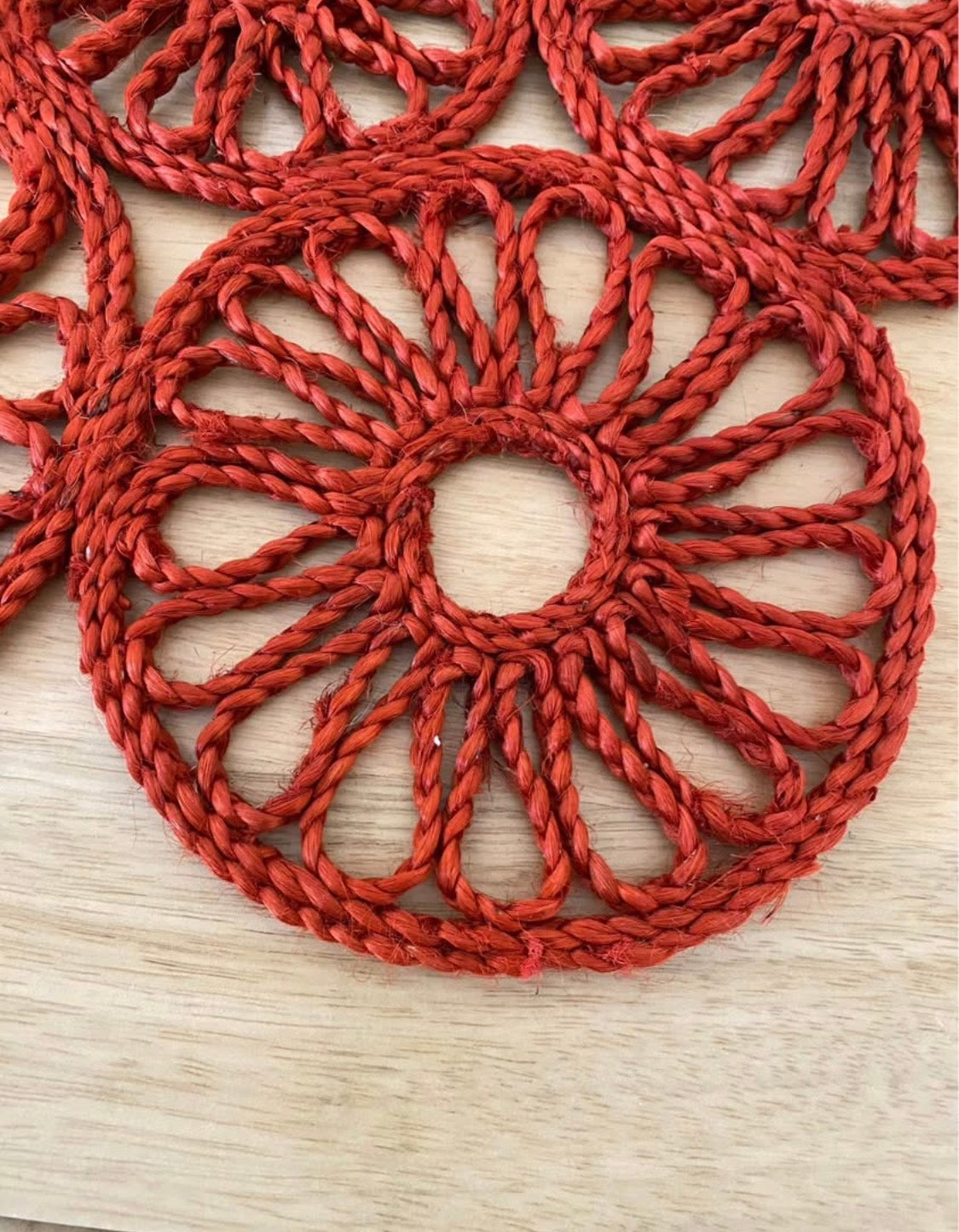 Handmade natural jute centre mat in burnt red colour - 40 cm diameter
