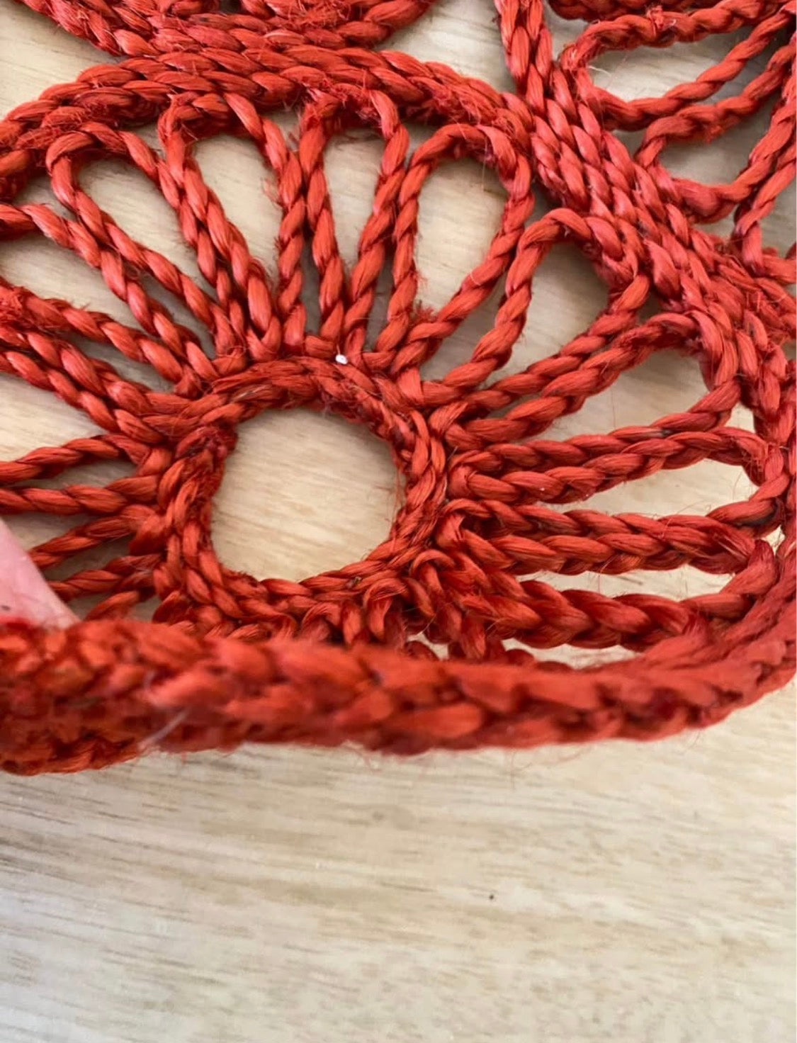 Handmade natural jute centre mat in burnt red colour - 40 cm diameter